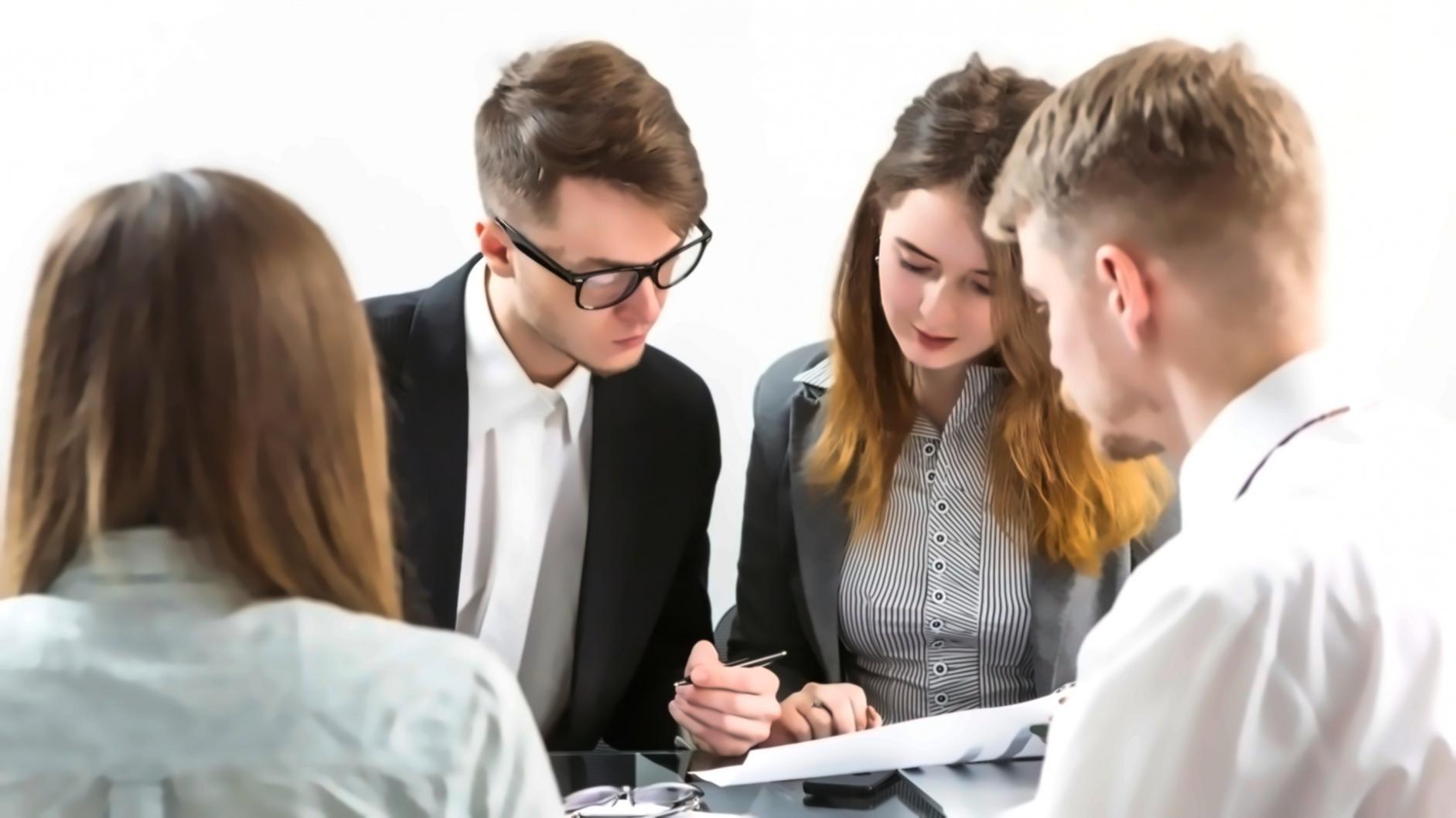 Financial analyst reviewing budget variance data with multiple screens showing charts and trend analysis