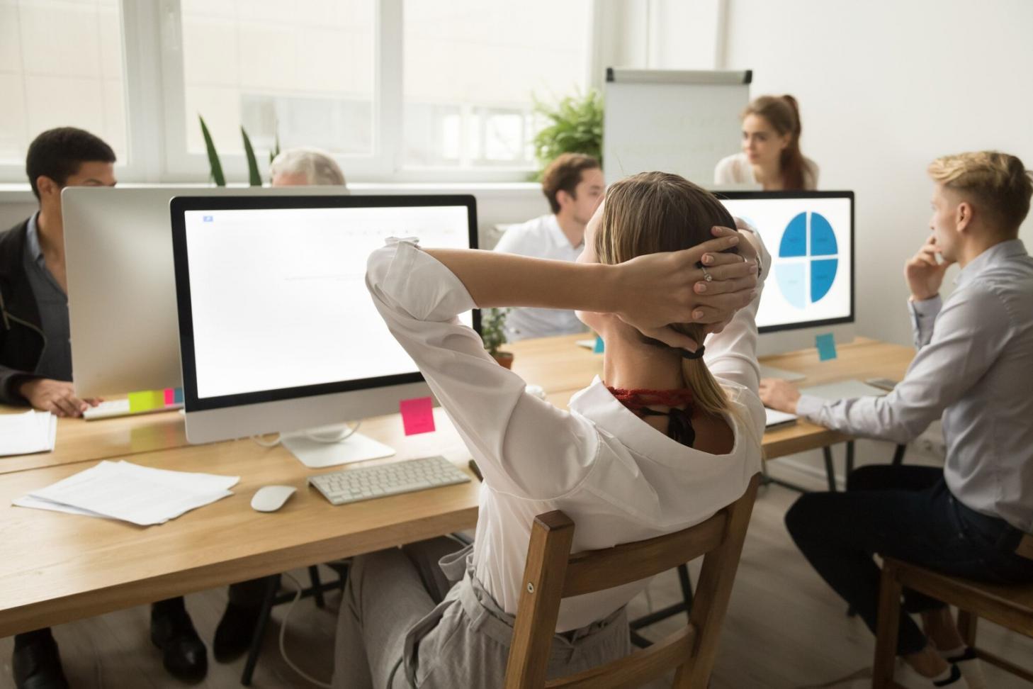 Financial analyst reviewing budget variance reports and charts